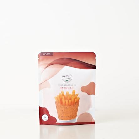 80 grams stand-up pouch packaging with zip lock of FERNA USA Fries Seasoning Barbecue Flavor. The front displays an illustration of french fries and a transparent part of the packaging that makes the powder seasoning visible for the customer to see.