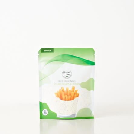 80 grams stand-up pouch packaging with zip lock of FERNA USA Fries Seasoning Sour Cream Flavor. The front displays an illustration of french fries and a transparent part of the packaging that makes the powder seasoning visible for the customer to see.